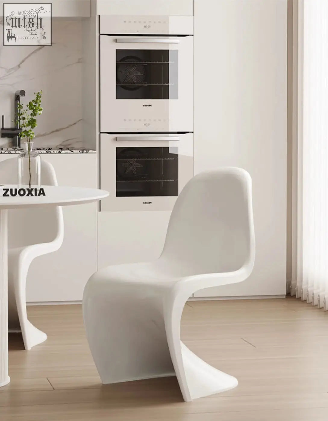 White molded plastic dining chair with sleek modern design perfect for aimee dining spaces