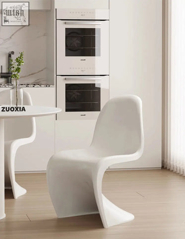 White molded plastic dining chair with sleek modern design perfect for aimee dining spaces