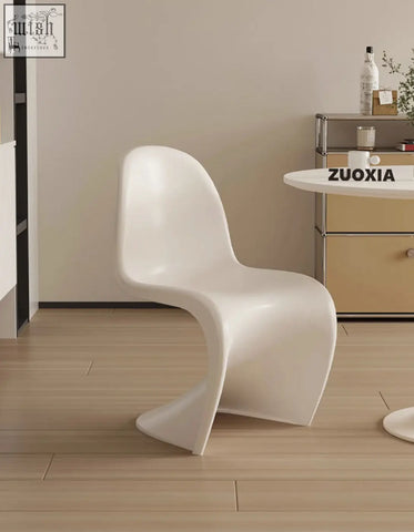 White molded plastic dining chair with sleek modern design perfect for aimee dining spaces