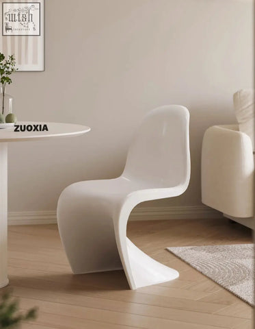White sleek plastic aimee dining chair with modern sculpted design perfect for stylish dining spaces
