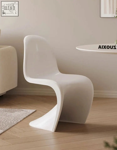 White sleek plastic aimee dining chair with modern sculpted design perfect for dining spaces