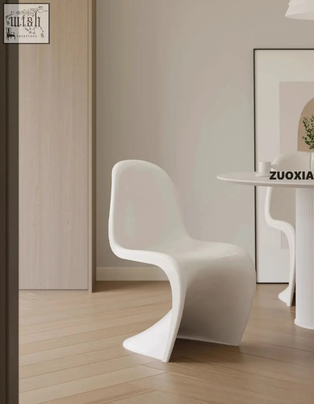 White sleek sculptural aimee dining chair made of smooth molded plastic perfect for stylish dining spaces