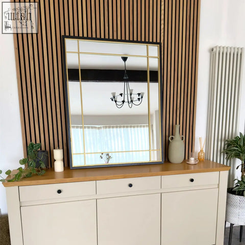 Rectangular aimi black window mirror with metal frame and gold grid lines measuring 95cm by 120cm