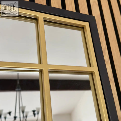 Aimi black and gold metal frame window mirror with a vintage industrial design and black trim 95cm by 120cm