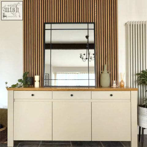 Aimi black metal window mirror with a rectangular frame and vertical wooden slats behind it measuring 95cm by 120cm