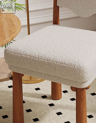 Cream-colored plush textured ainsley dining chair cover snugly fits wooden stool highlighting seat height comfort