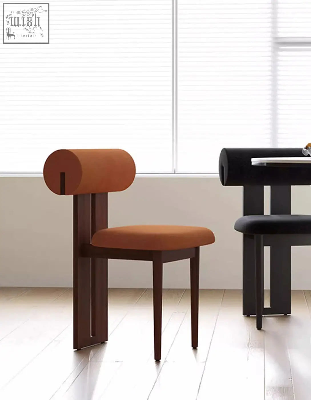 Airelle dining chair with tan cylindrical upholstered back and seat on black wood legs perfect dining chair