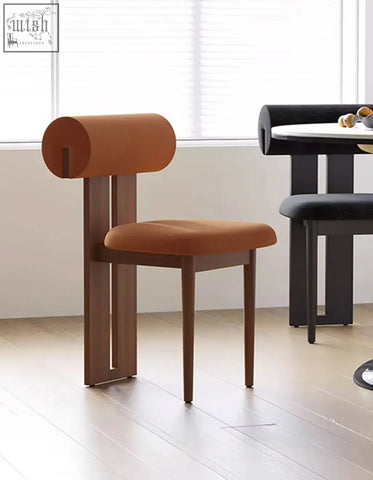 Brown upholstered airelle dining chair with cylindrical backrest and wooden legs perfect for dining areas