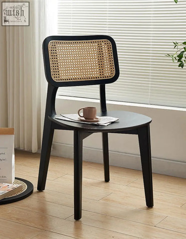 Black cane-back aislin rattan dining chair with a woven natural rattan seat and backrest perfect as a dining chair