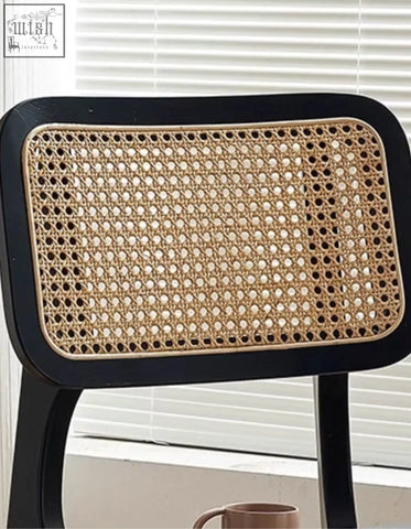 Black-framed aislin rattan dining chair with woven light brown rattan backrest perfect as a rattan dining chair