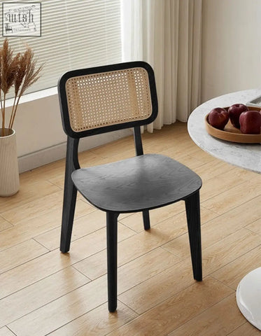 Black wooden aislin rattan dining chair with woven cane backrest perfect as a stylish dining chair