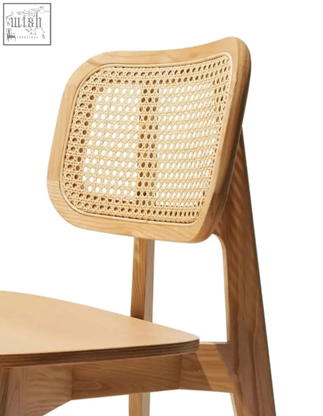 A light wood aislin rattan dining chair with woven rattan seat and cane-back frame perfect dining chair