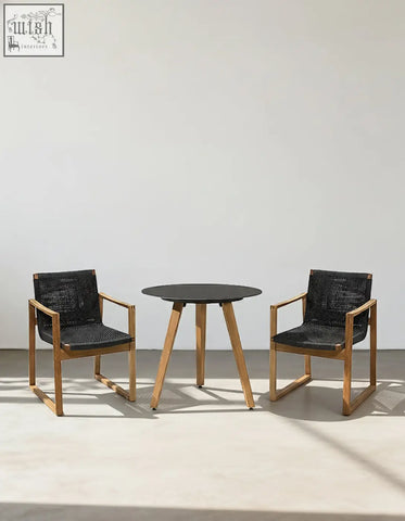 Modern outdoor dining set with round black tabletop, wooden legs, and light wood chairs with woven seats perfect for outdoor dining