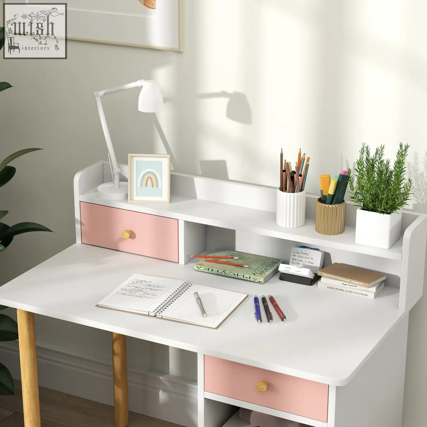 White kids desk and chair set with pink drawers wooden legs built-in shelf and wide desktop for study and storage
