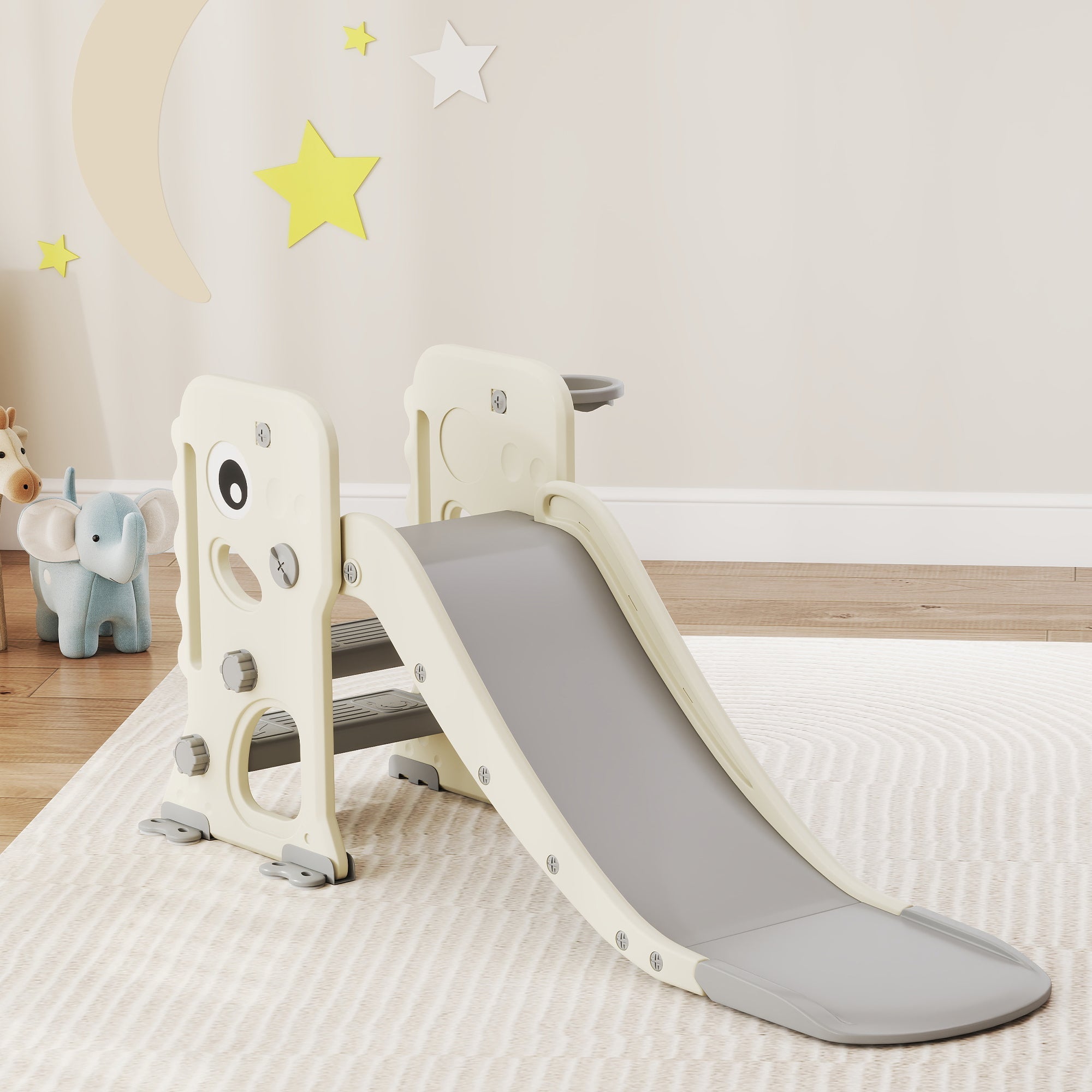 Cream-colored plastic kids slide with gray surface and playful eyes, reinforced buckles provide safety, includes basketball hoop
