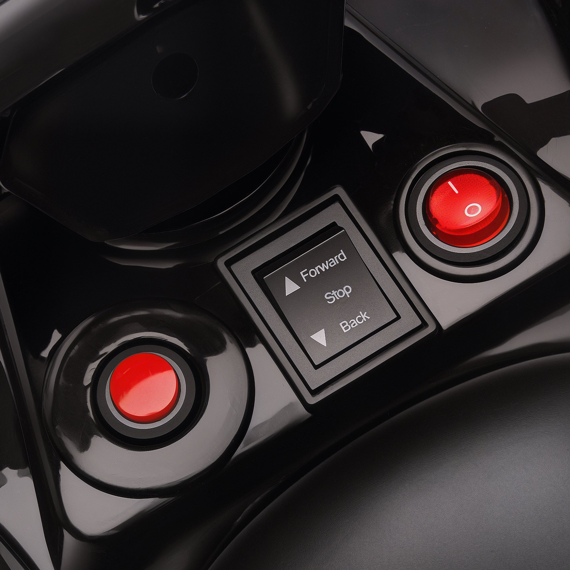 Black plastic control panel with red buttons and directional pad on aiyaplay 6v pink kids atv with bright headlights