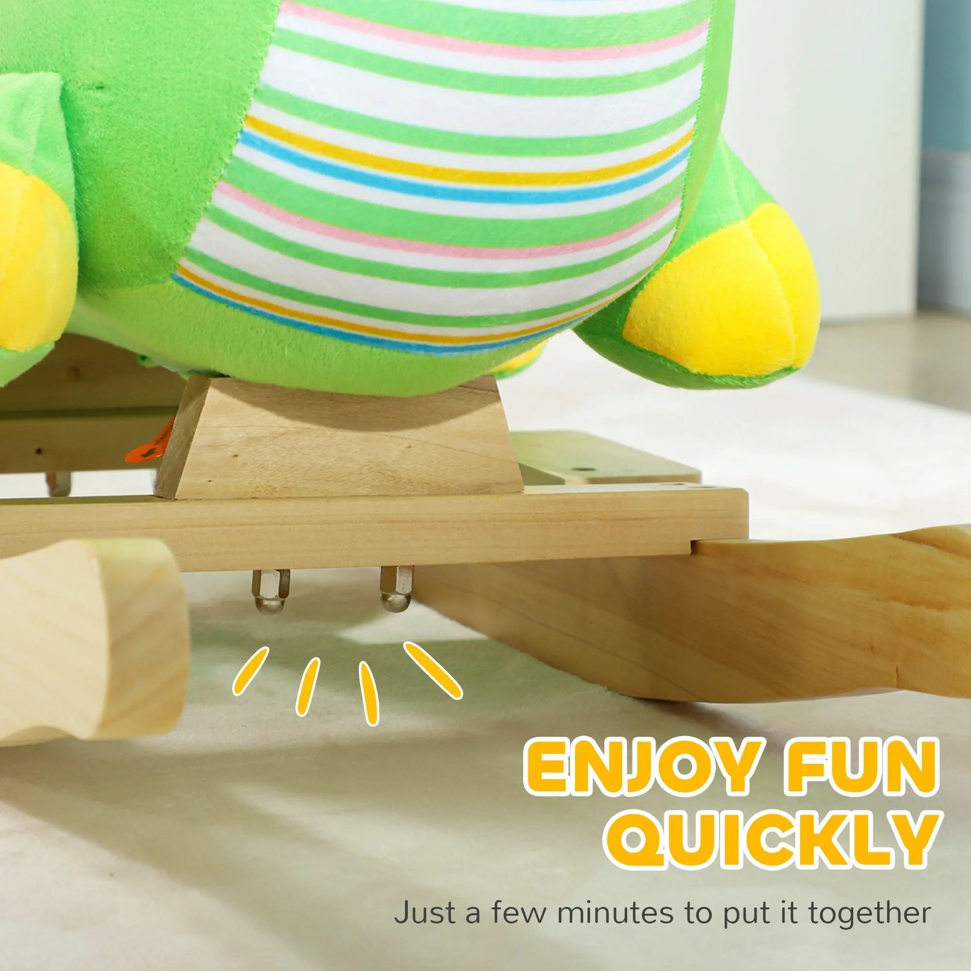 Green and yellow striped plush baby rocking frog with wooden base and animal sounds for toddlers 18 to 36 months