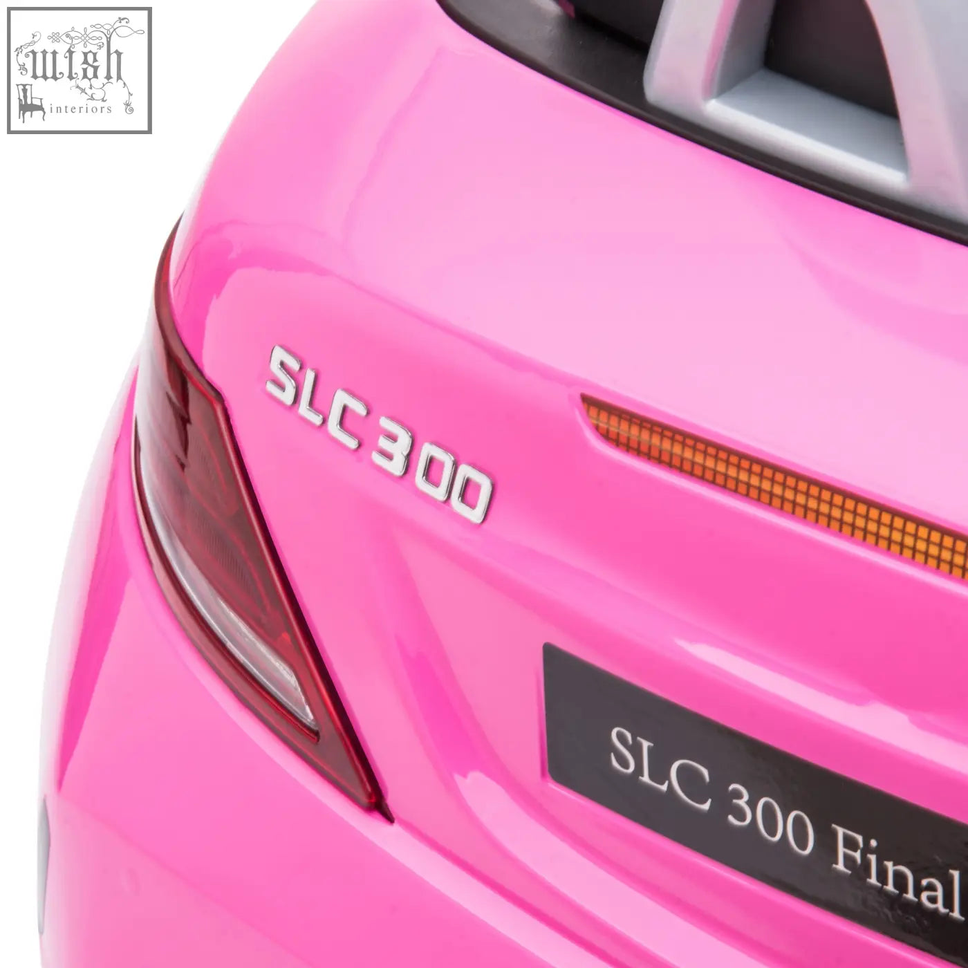 Bright pink benz slc 300 electric ride toy car with remote control and slc 300 final black license plate visible from back