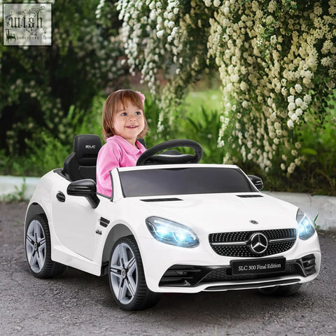 White benz slc 300 kids electric ride on car with remote control, black accents, lights, and suspension wheels