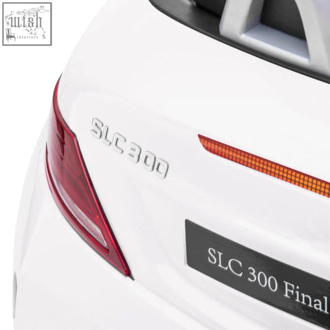 Back of white aiyaplay benz slc 300 electric ride showing slc 300 final edition badge with silver lettering and remote control