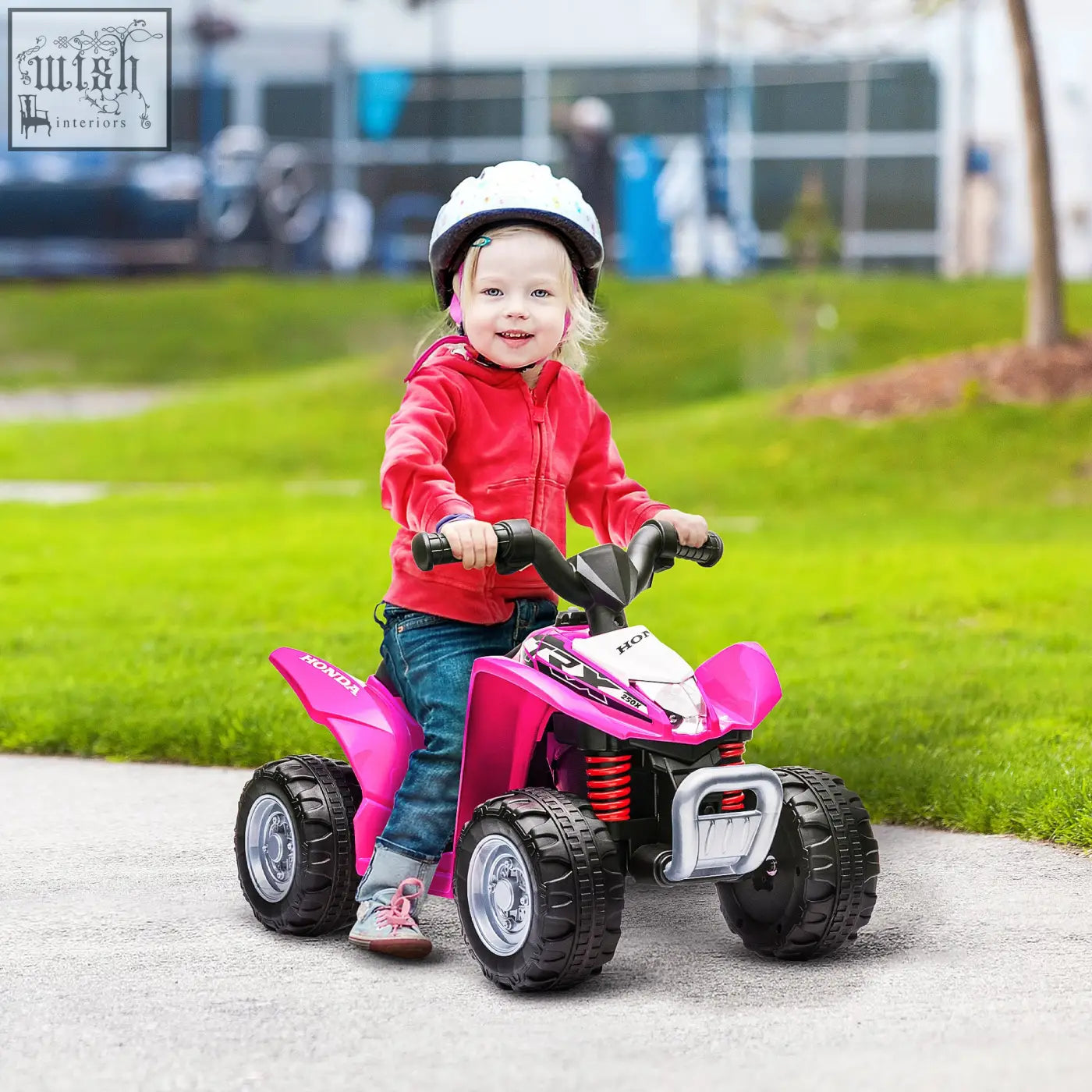 Pink and white honda licensed kids electric quad bike with black tires silver bumper and foot pedal for authentic driving experience
