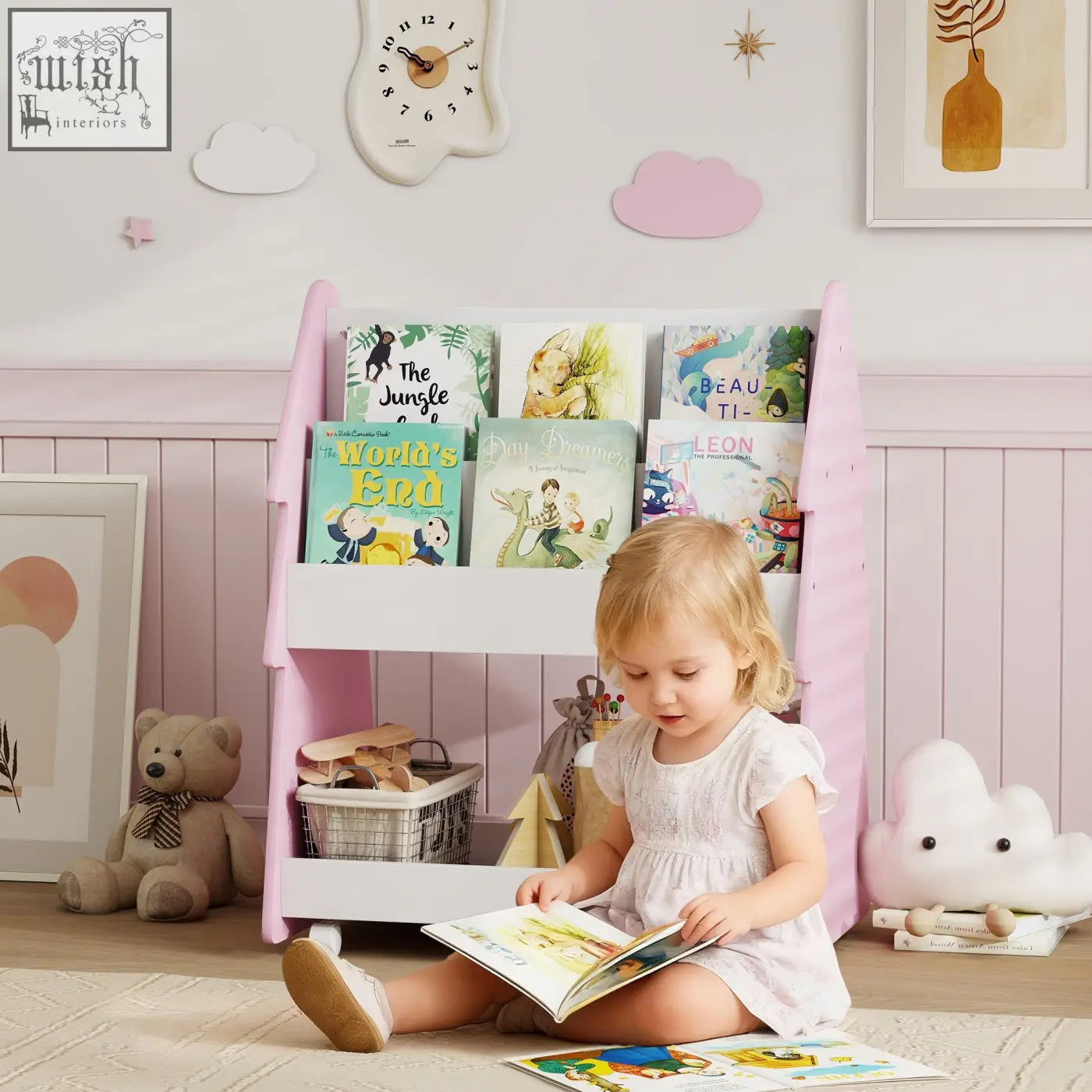Pink aiyaplay kids bookshelf with white accents and four universal wheels holding children’s books on both tiers