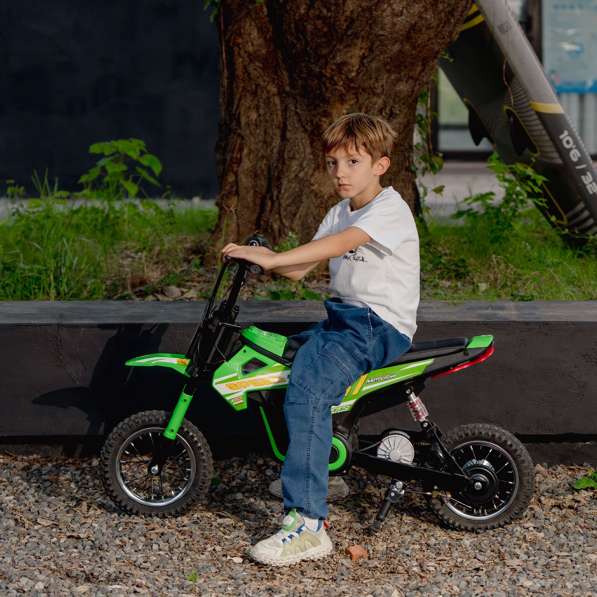 Green and black aiyaplay kids electric dirt bike with yellow accents 24v 3 speeds rear suspension for kids 8-12 years