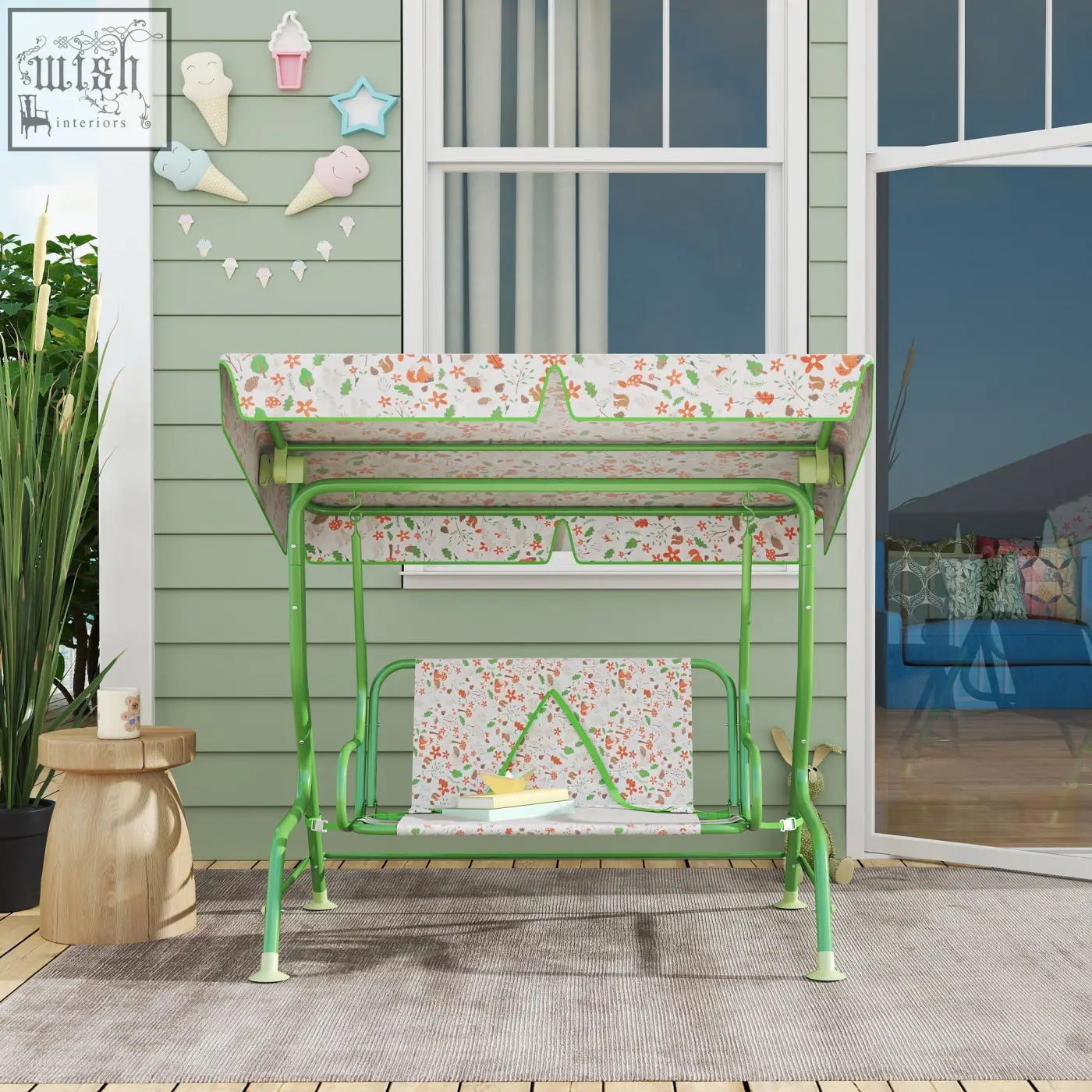 Green metal kids garden swing bench with floral adjustable canopy and non-skid feet for patio or porch use