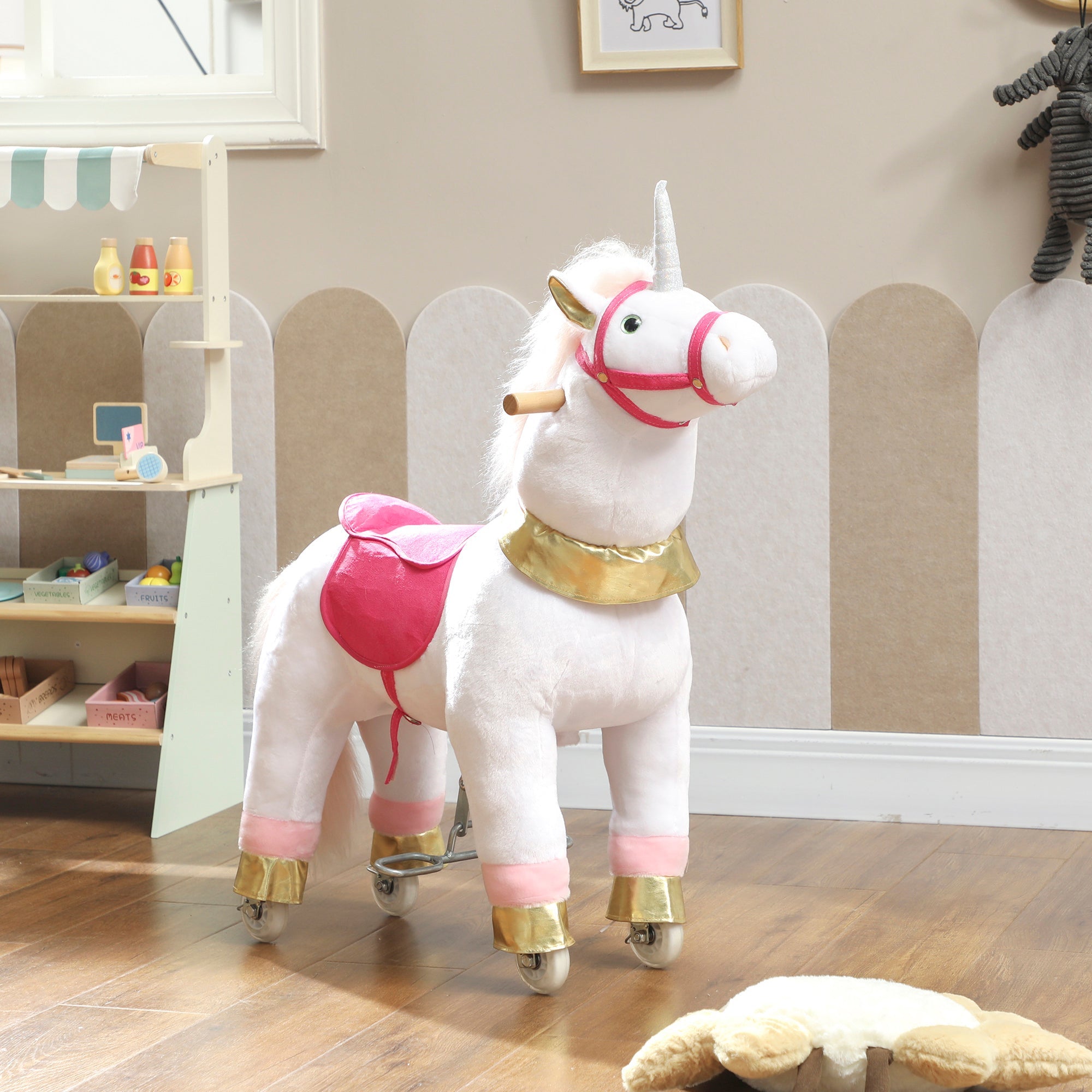 White plush kids rocking horse unicorn with pink saddle gold accents and wooden handle for ages 3 to 5 years
