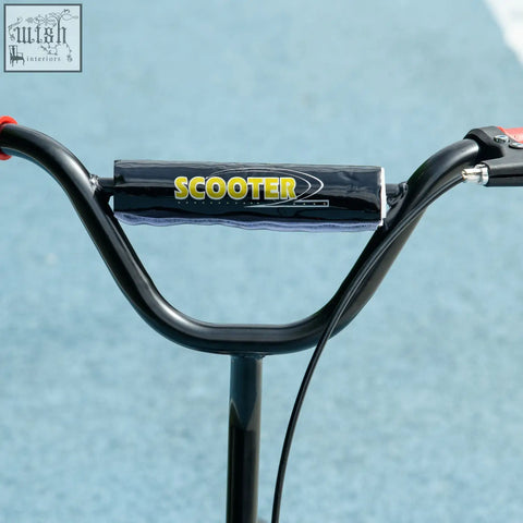 Black handlebar grip with yellow scooter branding on aiyaplay kids scooter featuring rear brake and non slip footplate