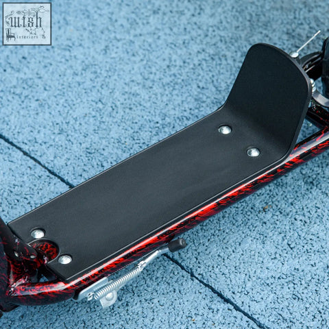 Black textured footplate with silver rivets on red and black marbled frame of aiyaplay kids scooter with rear brake
