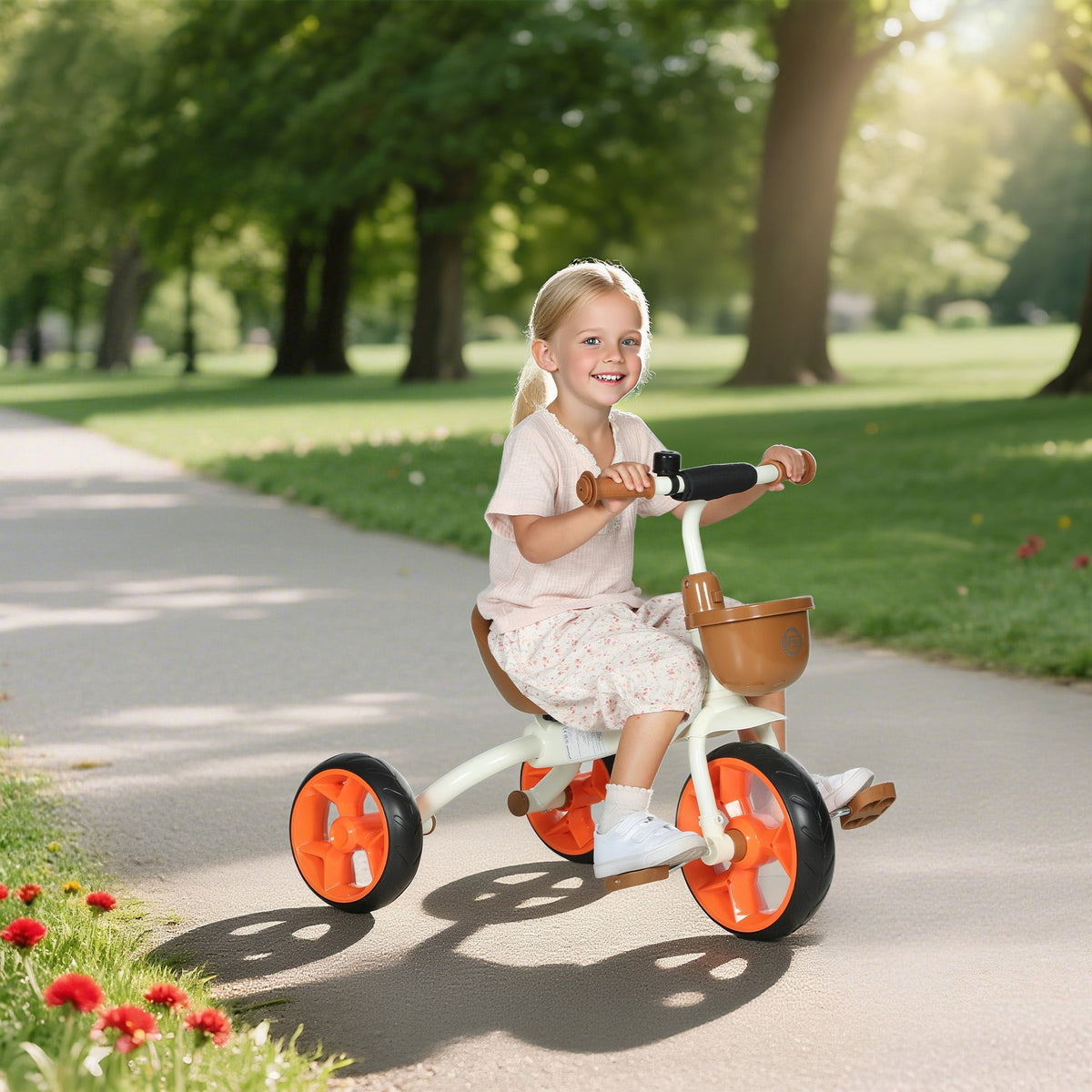 A child rides an aiyaplay kids trike toddler tricycle in white and orange with a brown front basket and eva wheels