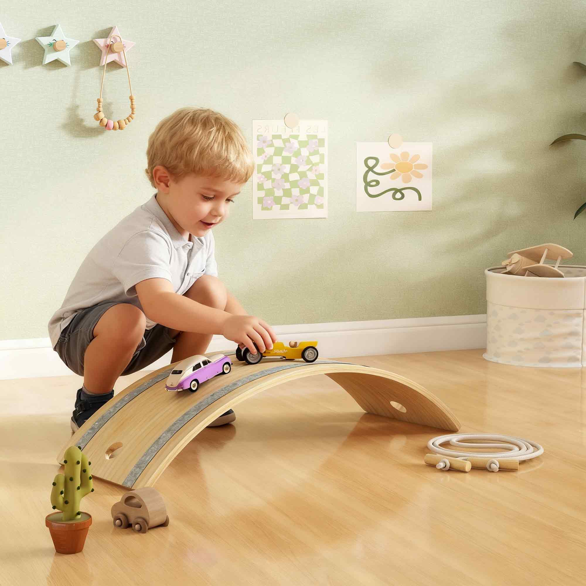 Light-colored wooden kids balance board with gray rubber strip for sensory play and balance training ages 3 to 6 years