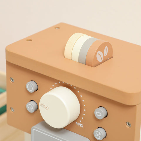 Tan wooden coffee machine toy with white dial gray buttons and colorful bean-shaped knobs for pretend play kitchen fun