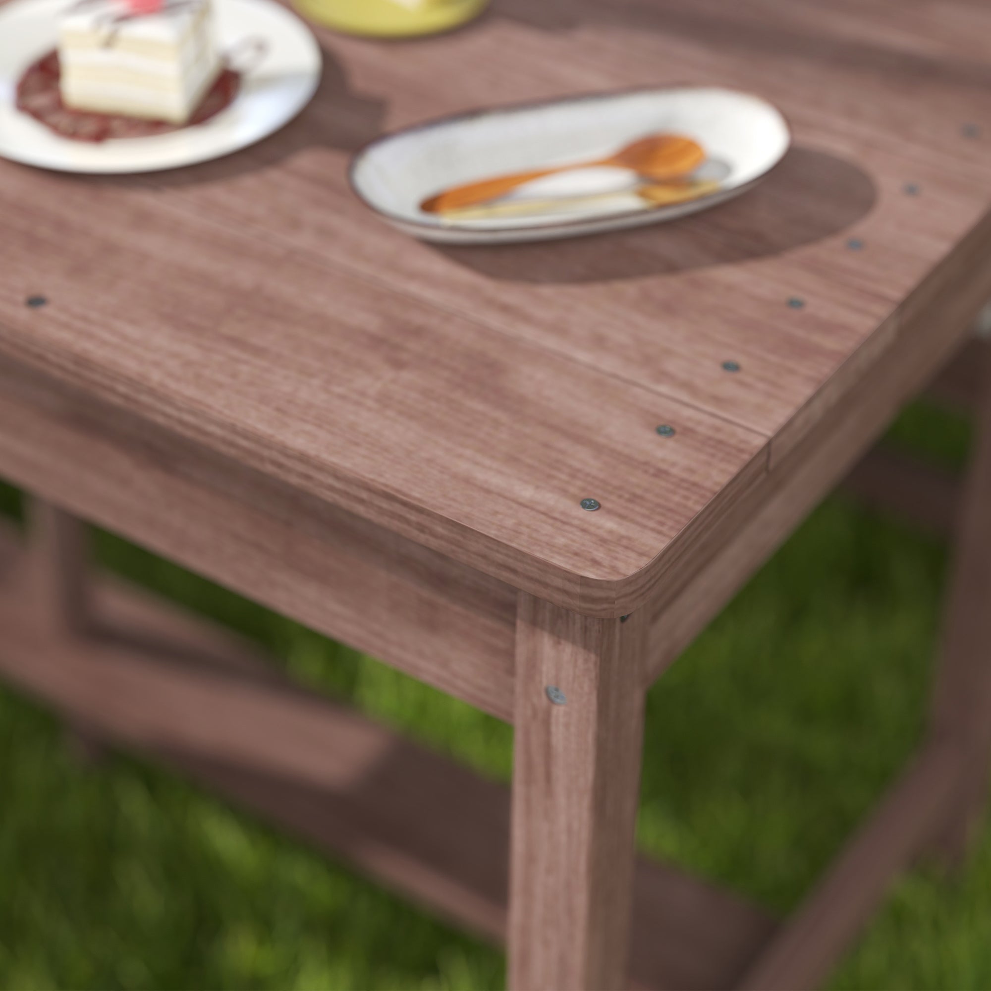 Rustic fir wood kids picnic table with visible screws and navy blue cushions perfect for four children outdoors