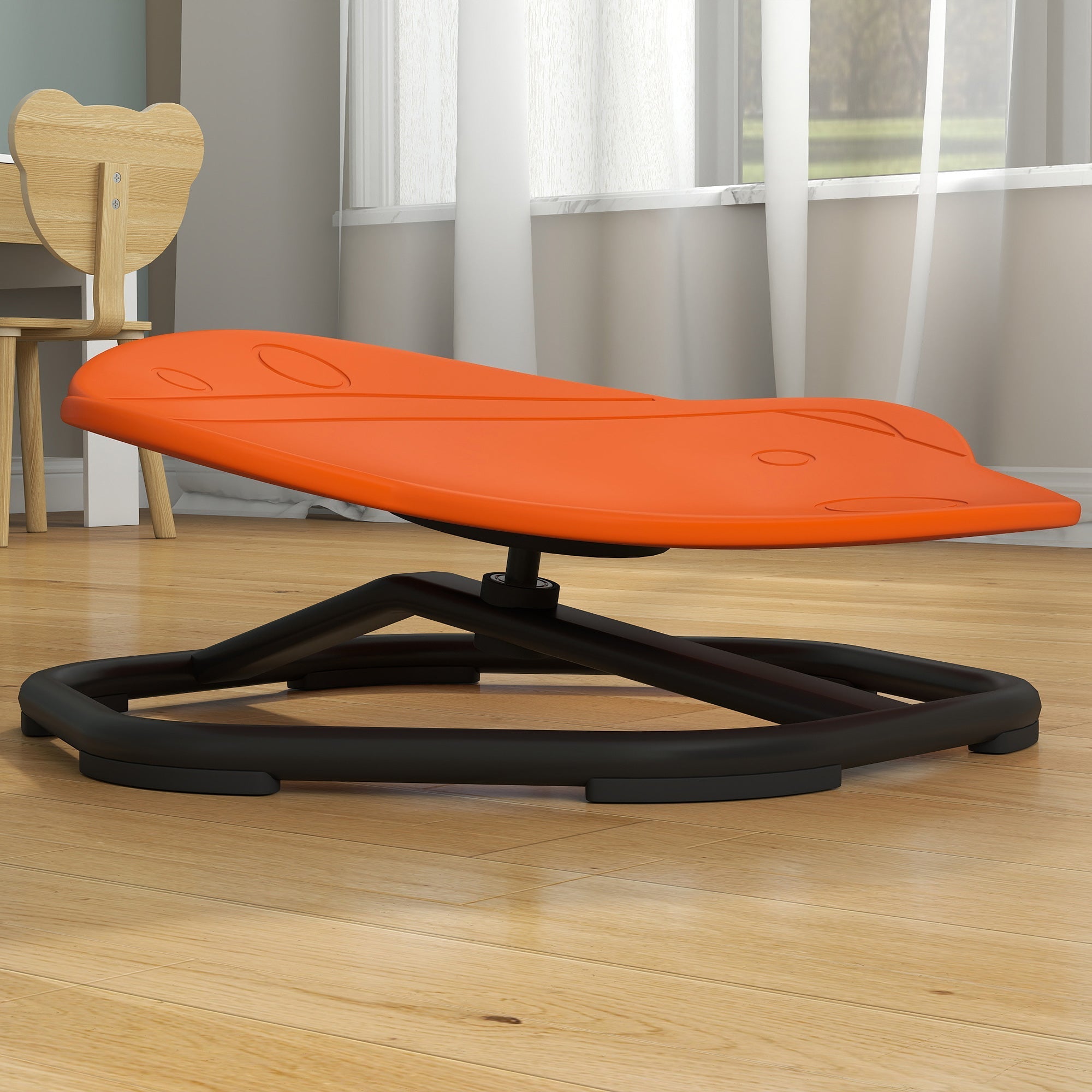 Orange plastic butterfly-shaped sensory spinning chair with black metal base for balance and coordination training