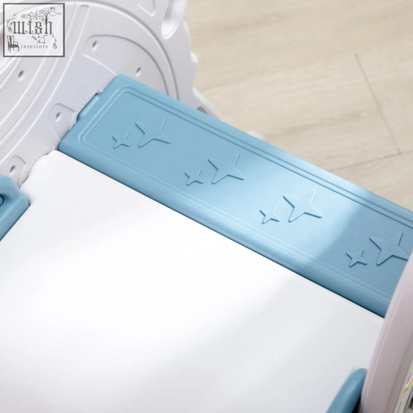 Light blue plastic panel with embossed stars on aiyaplay space themed kids slide buffer zone for toddlers