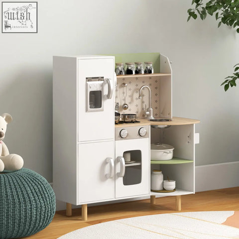 White wooden aiyaplay kids kitchen with green countertop ice maker stove and utensils for role playing fun