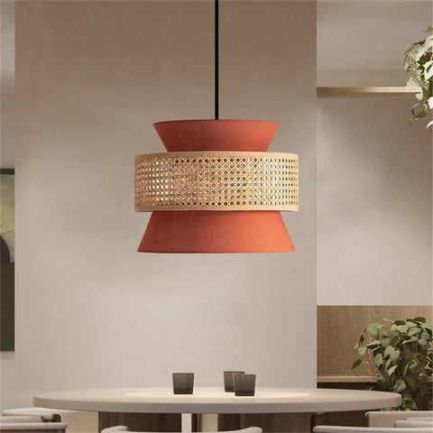 Terracotta-colored aka light pendant lamp with a woven cane band perfect for cozy indoor lighting