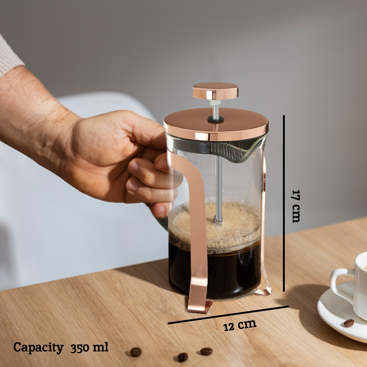 A 350 ml akeala rose gold cafetiere with clear glass body and sleek rose gold finish for perfect coffee brewing