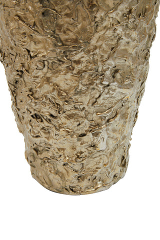 A gold textured small metal vase with a rough sculpted surface resembling molten metal called akola gold textured