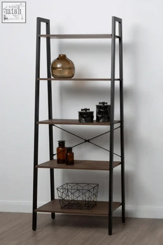 Dark wood and black metal ladder shelf with diagonal cross braces showcasing a large black and gold trinket box