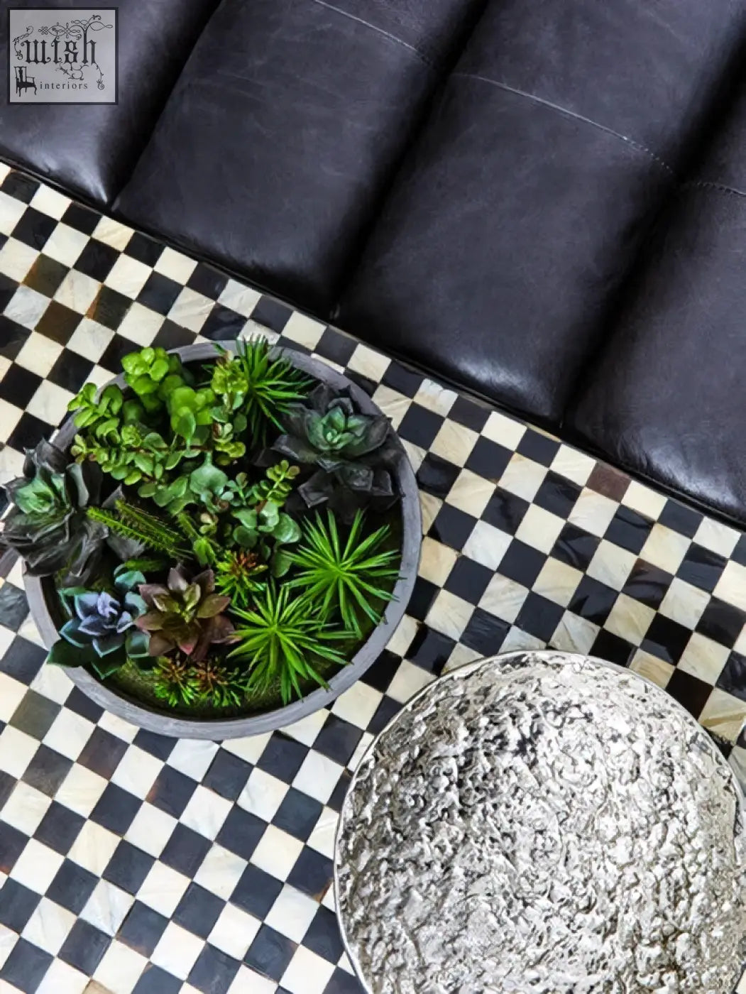 Akola silver textured decorative bowl with a round gray ceramic planter filled with green and purple succulents