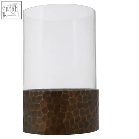 Clear glass cylinder candle holder with hammered bronze base in small antique gold finish for elegant decor