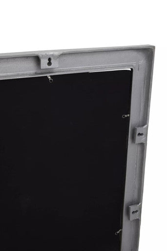 Gray metal-framed rectangular wall mirror with textured silver frame and black panel display screen