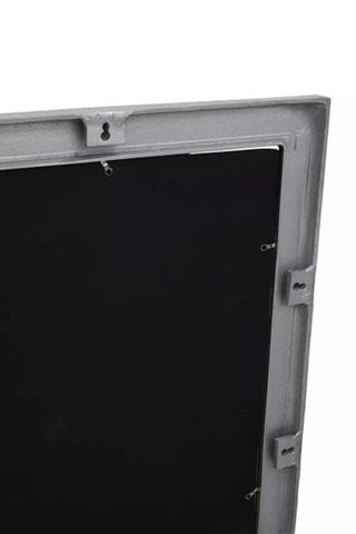 Gray metal-framed rectangular wall mirror with textured silver frame and black panel display screen