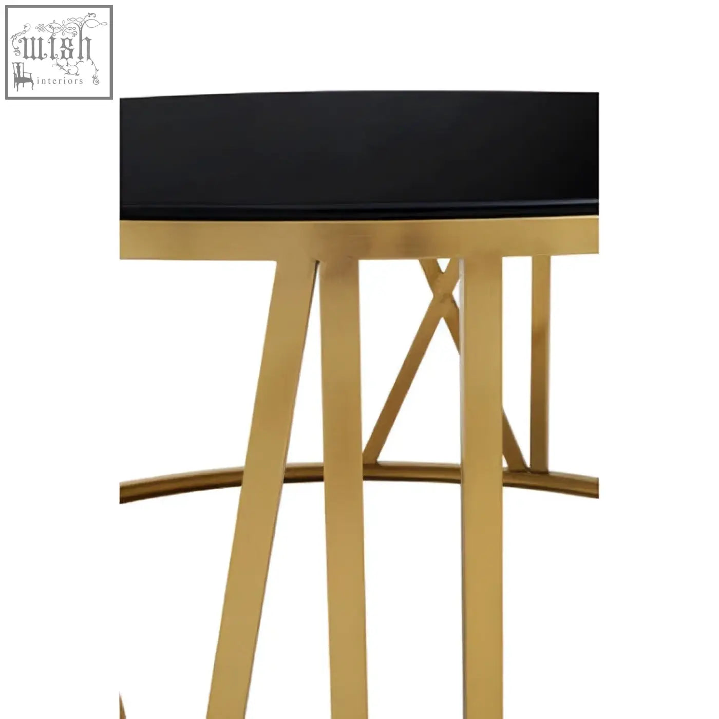 Black glass-top bar stool with gold metal legs and geometric support next to a round coffee table with gold frame and black glass
