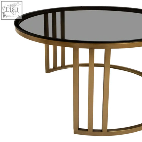 Alana set of 2 nesting coffee tables with gold-toned metal base and oval mirrored glass top with vertical slat legs