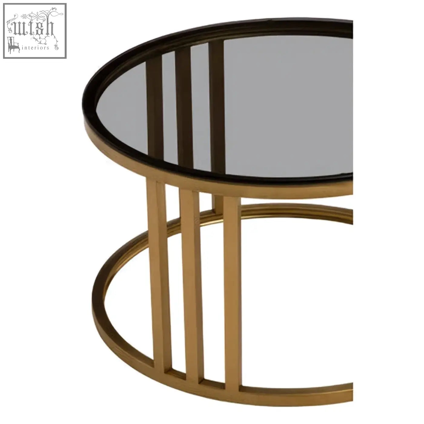 Gold-toned metal nesting coffee tables with round mirrored tops and vertical slat bases from the alana set of 2