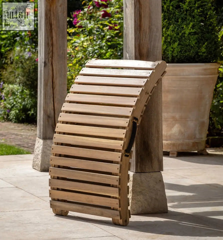 Light-colored acacia wood foldaway sunlounger with slatted design small wheels and carry strap by alazzo